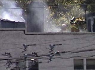 fireman chopping through roof